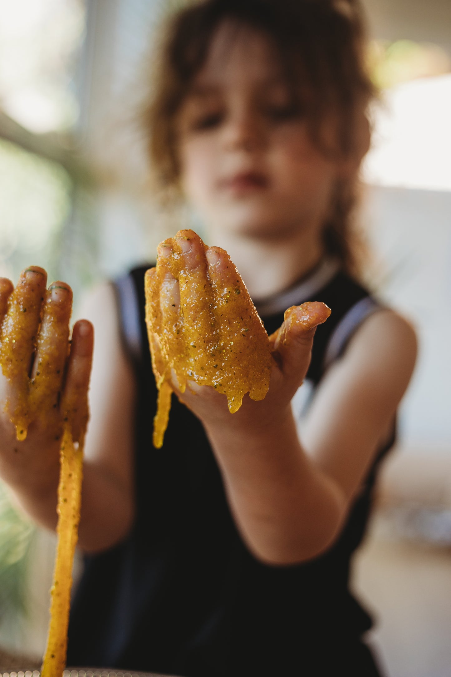 angler fish puke is a disgustingly gooey natural taste safe slime made from psyllium. yellow ocean goo from the saltwater collective for sensory play for kids