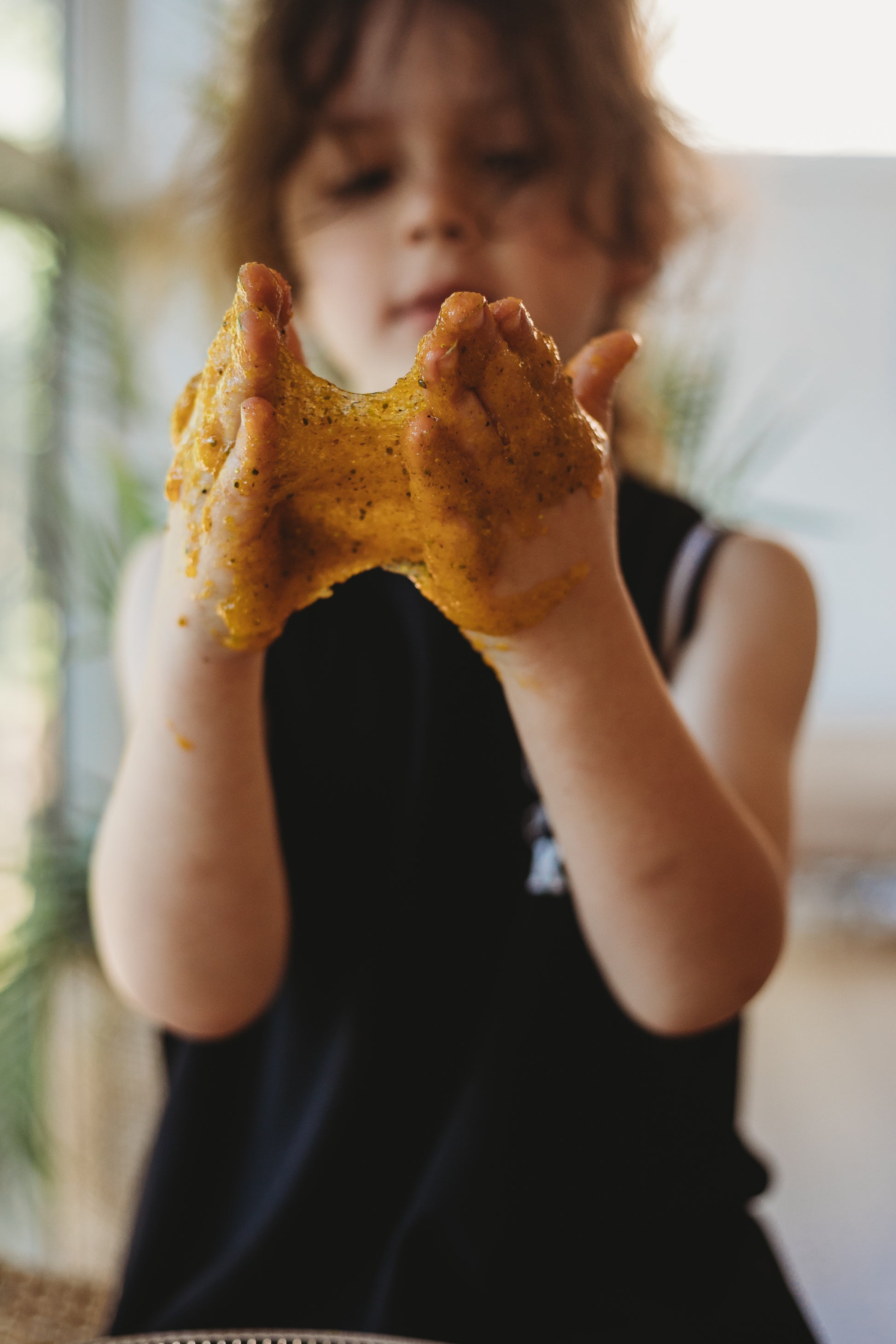 angler fish puke is a disgustingly gooey natural taste safe slime made from psyllium. yellow ocean goo from the saltwater collective for sensory play for kids