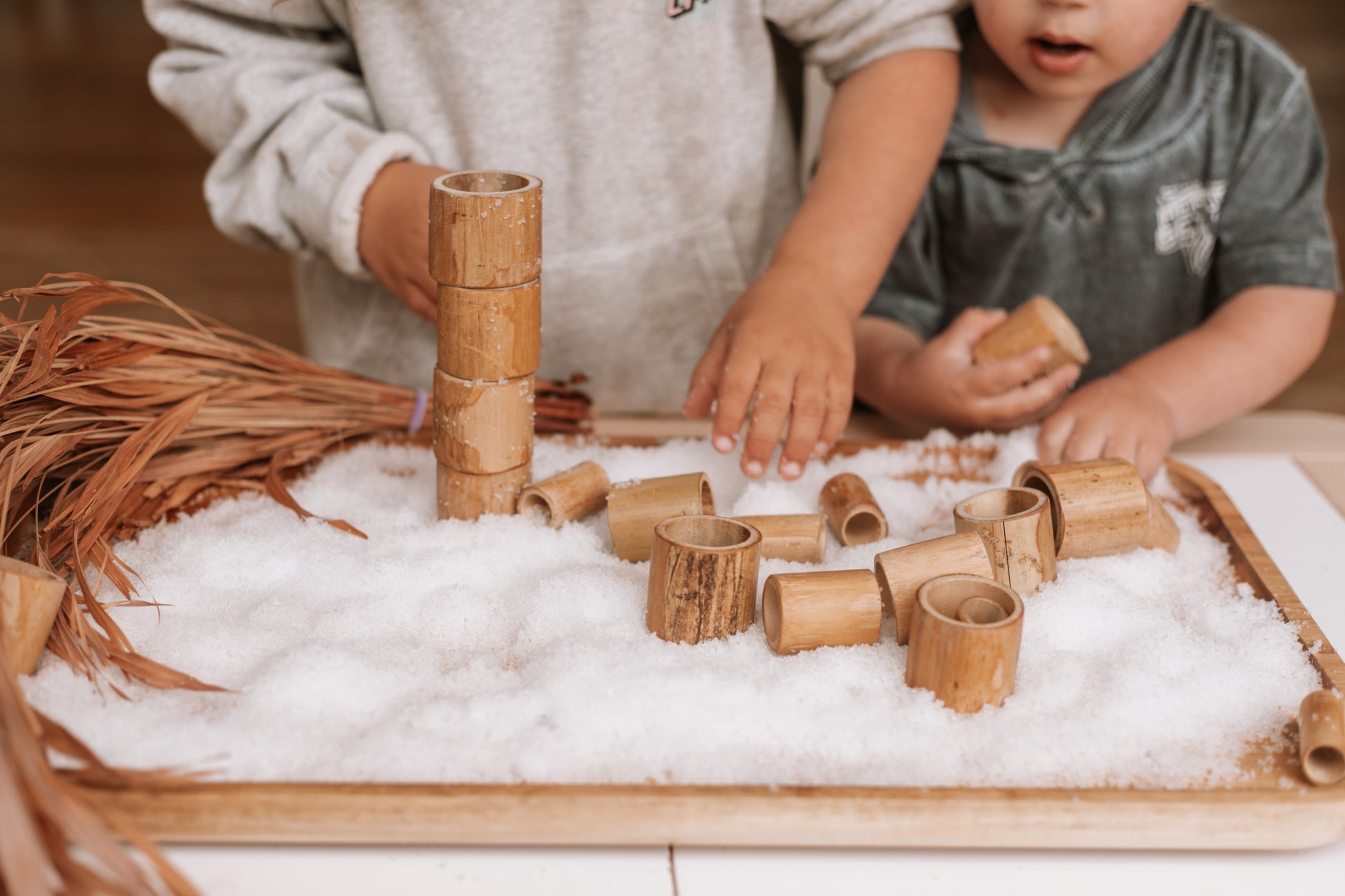 snowflakes white instant snow. winter play with bamboo tubes
